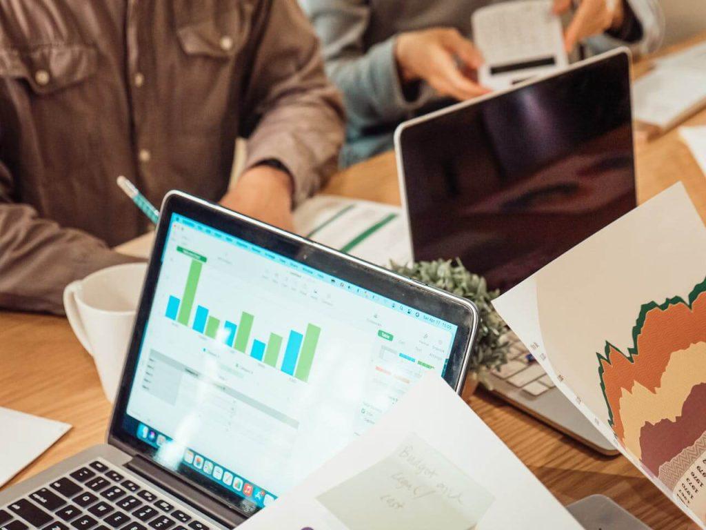 Professionals discussing analytics and strategies, highlighting the importance of top-notch SEO services in Pakistan for businesses.